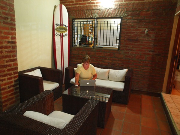 Anne writing the Travel Virgins journal post