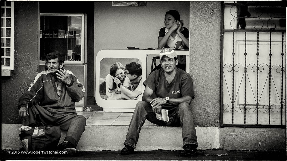 Two men photo store doorway